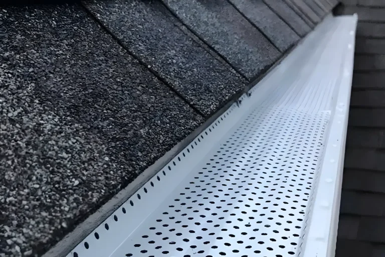 Clean, White Erie Gutters with Installed Shur Flo Gutter Guards.